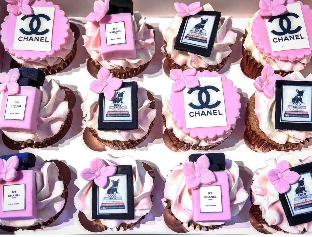 Cupcakes with Chanel Paris perfume bottles made out of fondant on top
