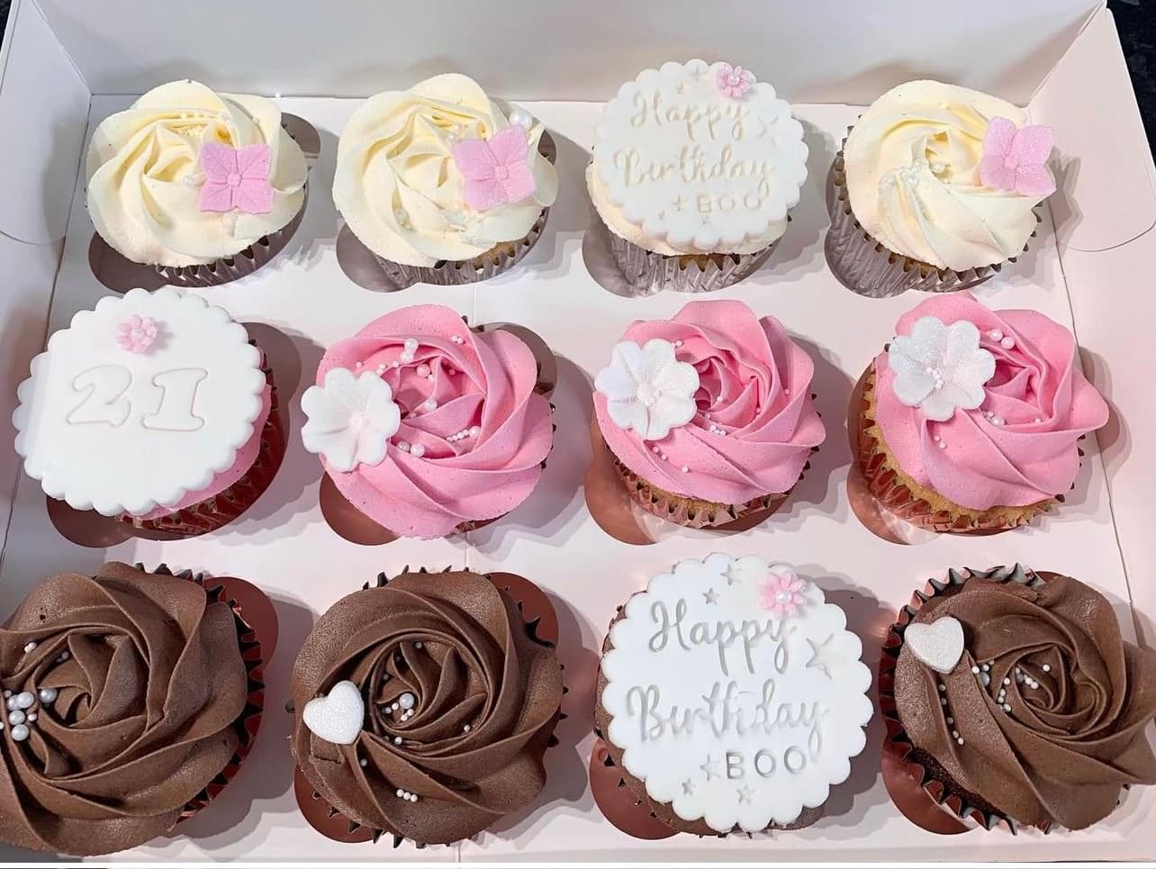 Pink, brown and cream iced cupcakes for a twenty-first birthday