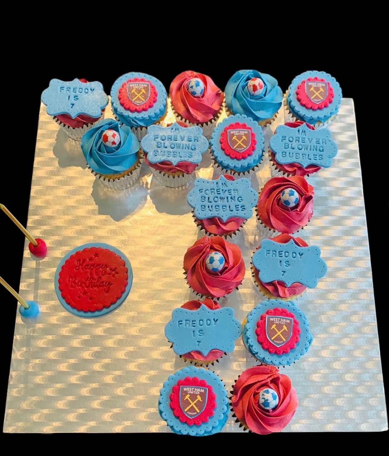 Cupcakes in the shape of the number seven with blue and red toppings and West Ham United logos